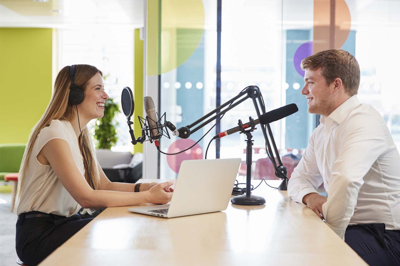 Man and woman use podcasts as a marketing tool