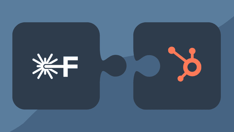 Illustration showing integration between FrontCore's Training Management System (TMS) and HubSpot's CRM, represented by two interlocking puzzle pieces with the FrontCore and HubSpot logos.