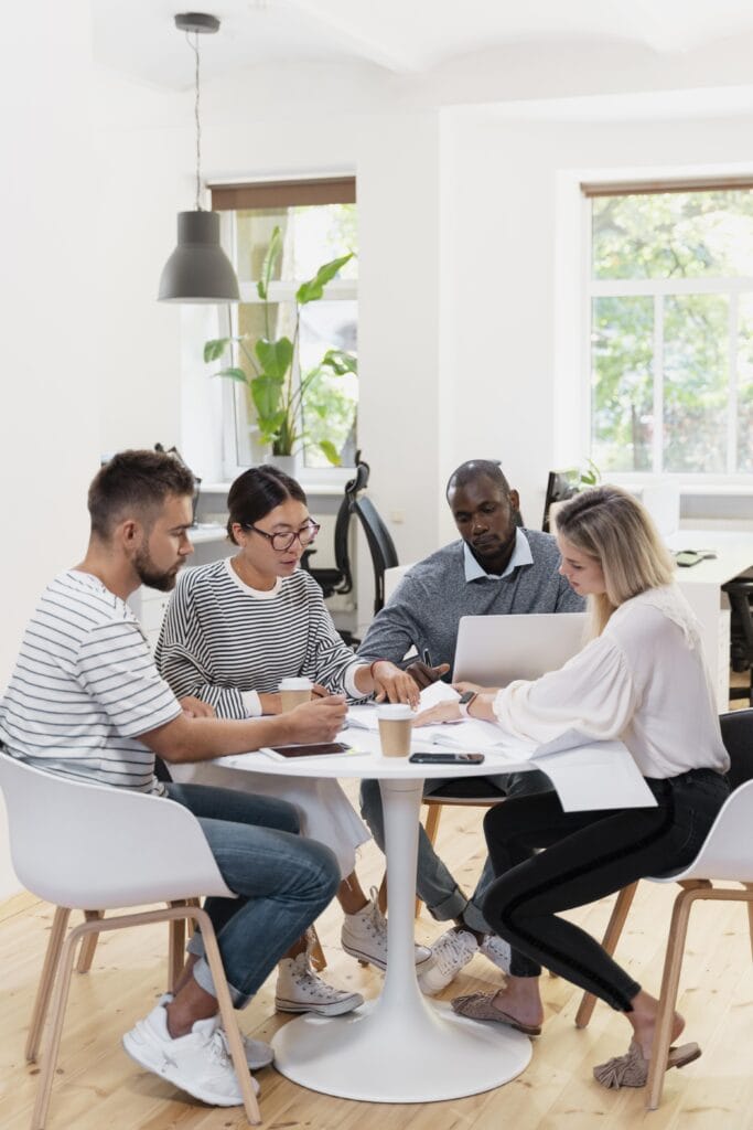 Participants actively engaged in a group discussion during a training session