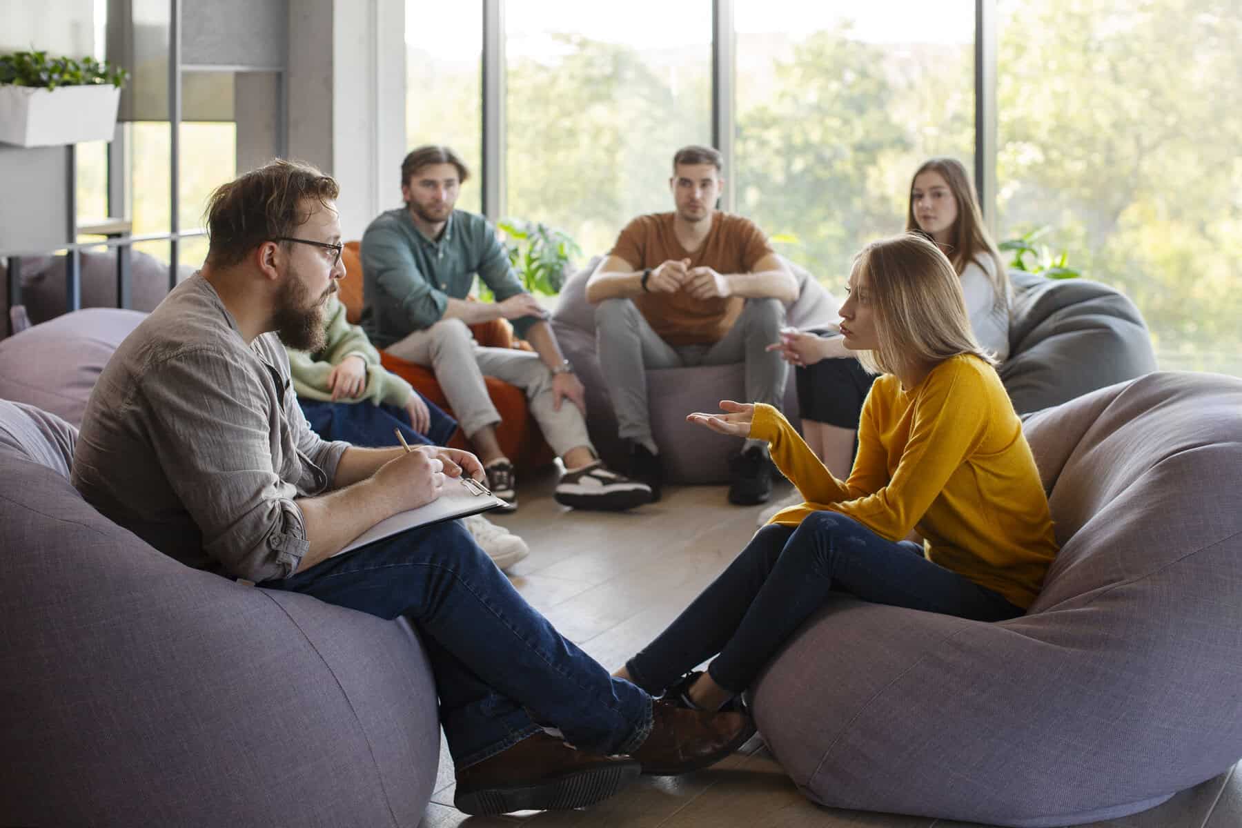 productive group discussion among course participants in a training room