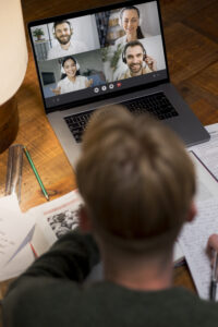Learner participating in a virtual group discussion during online training