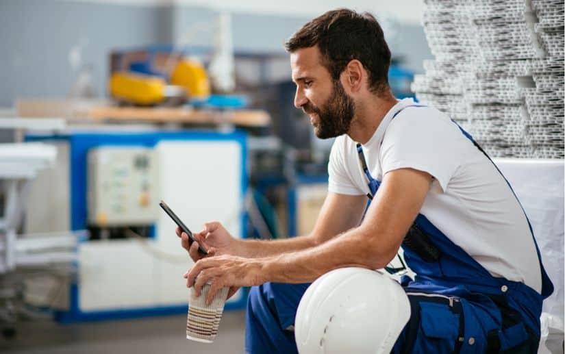 Secure payment on mobile when booking health and safety training at work Worker booking courses through phone with secure payment